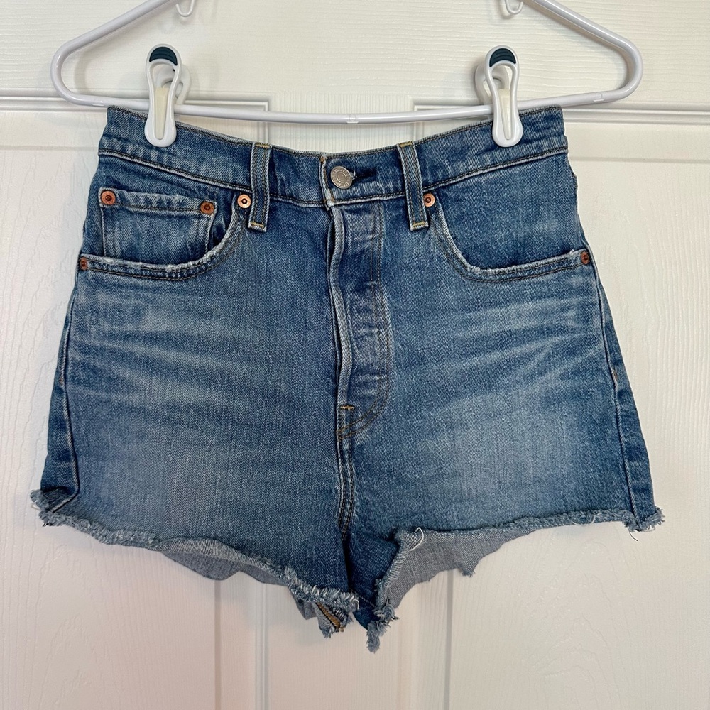 Levi’s Brand high waisted denim shorts. Medium wash. Size 28 waist. 2.5” inseam